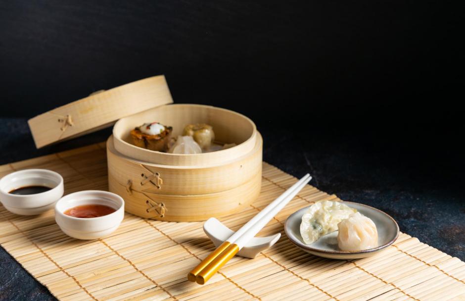 Traditional dim sum steamed in a small bamboo basket.