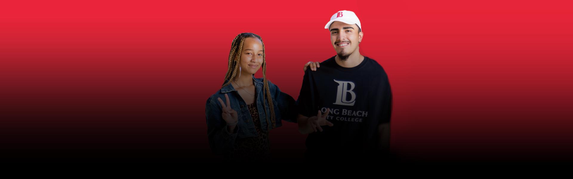 two young Long Beach City College smiling with their fingers show V's as Vitory signs