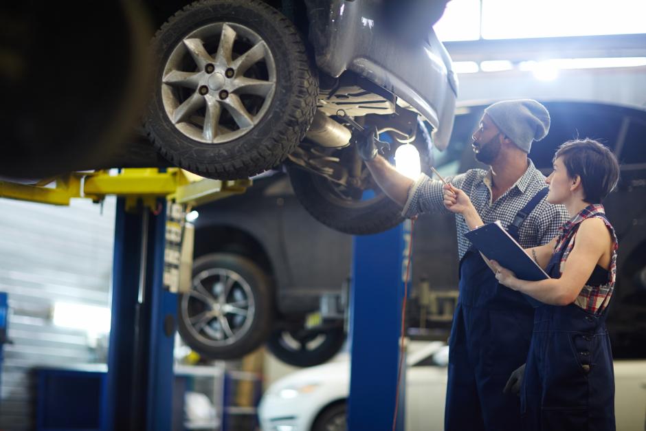 A women and a man working in auto shop in Automotive Repair Session