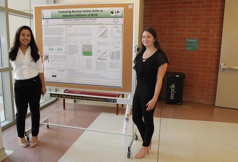2 LBCC students standing next to their science research board at Bridges to the Baccalaureate Program