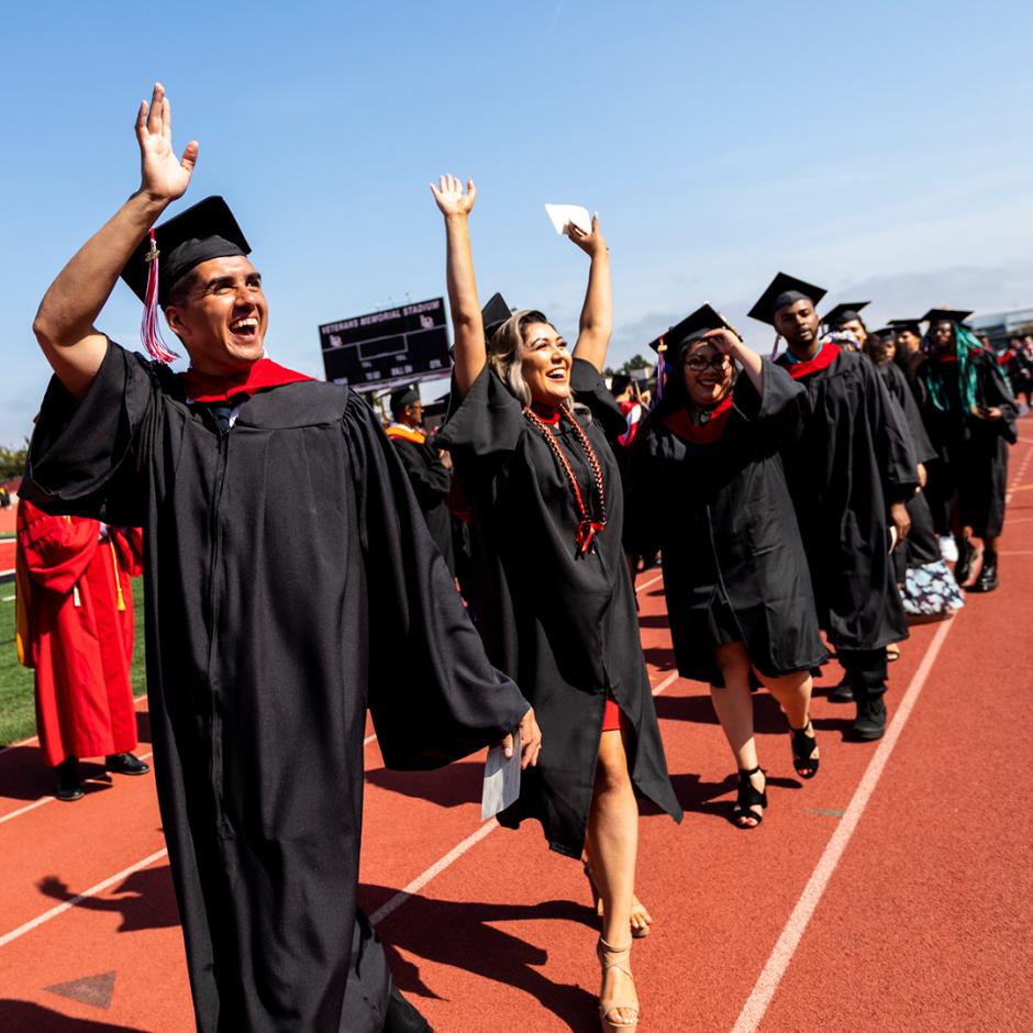 LBCC students are waving at their family at the Commencement 