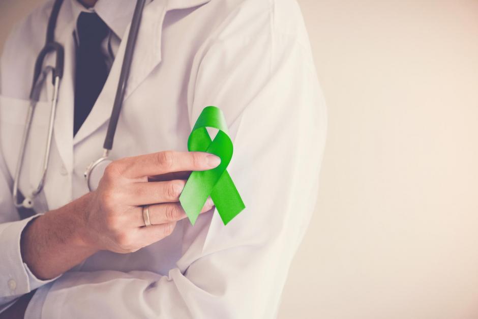 Doctor hands holding Lime Green ribbon, Mental health awareness