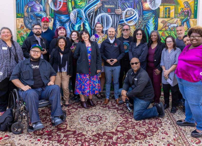 LBCC Staff group shot in front of a mural - LAC