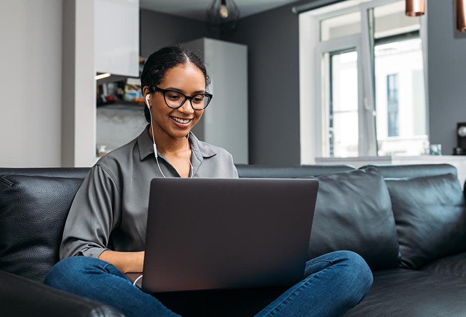 a young women searching for Grievance Process & Applicable Laws on laptop