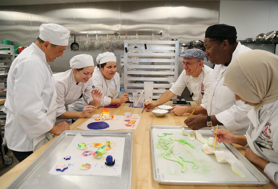 Chef Pierre and Several Students Analyze a Pastillage Project 