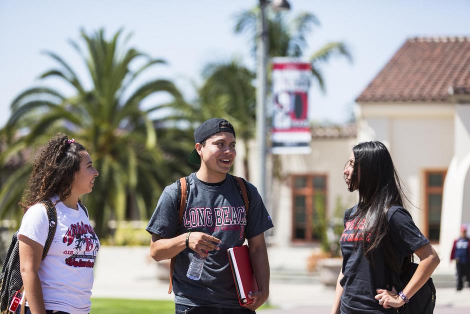 3 lbcc students in LAC campus chatting with each other