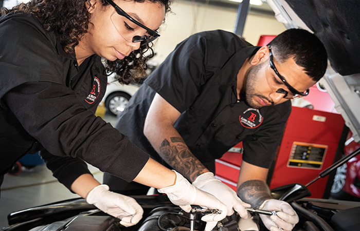 2 lbcc trade students are working of  car engine