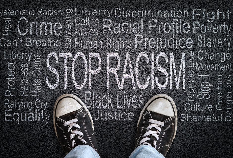 Stop Racism Word Cloud on Asphalt Concept of Fighting Discrimination
