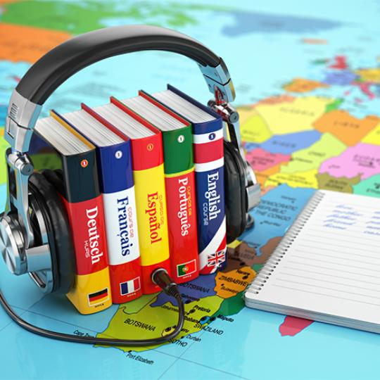 Learning languages online. Audiobooks concept. Books and headphone